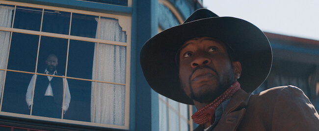 Jonathan Majors looking off camera