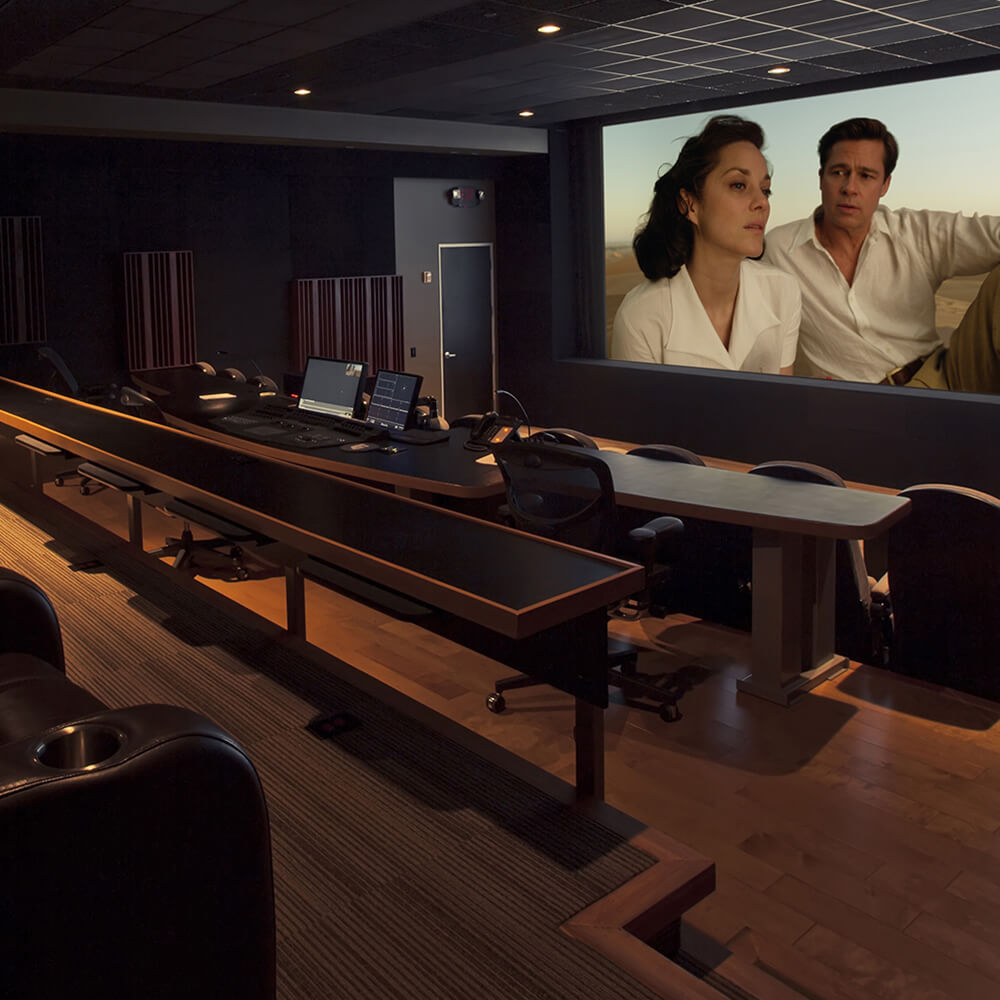 Light Iron color theater with movie playing on projector screen